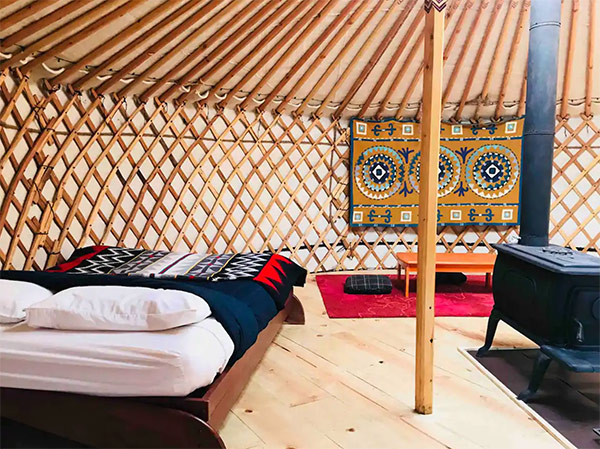 interior shot of the mongolian yurt, showing the bed