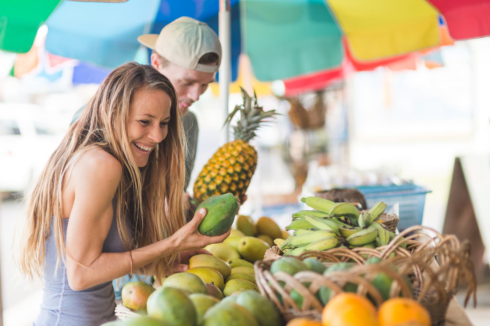 Man and woman shopping for fruit on Oahu