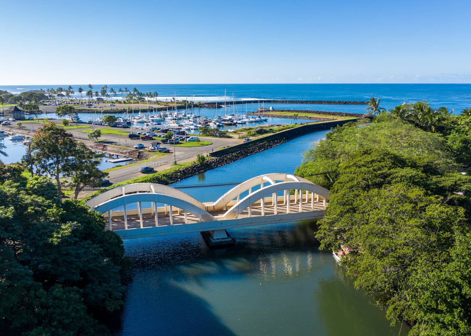 A bridge with a harbor in the background