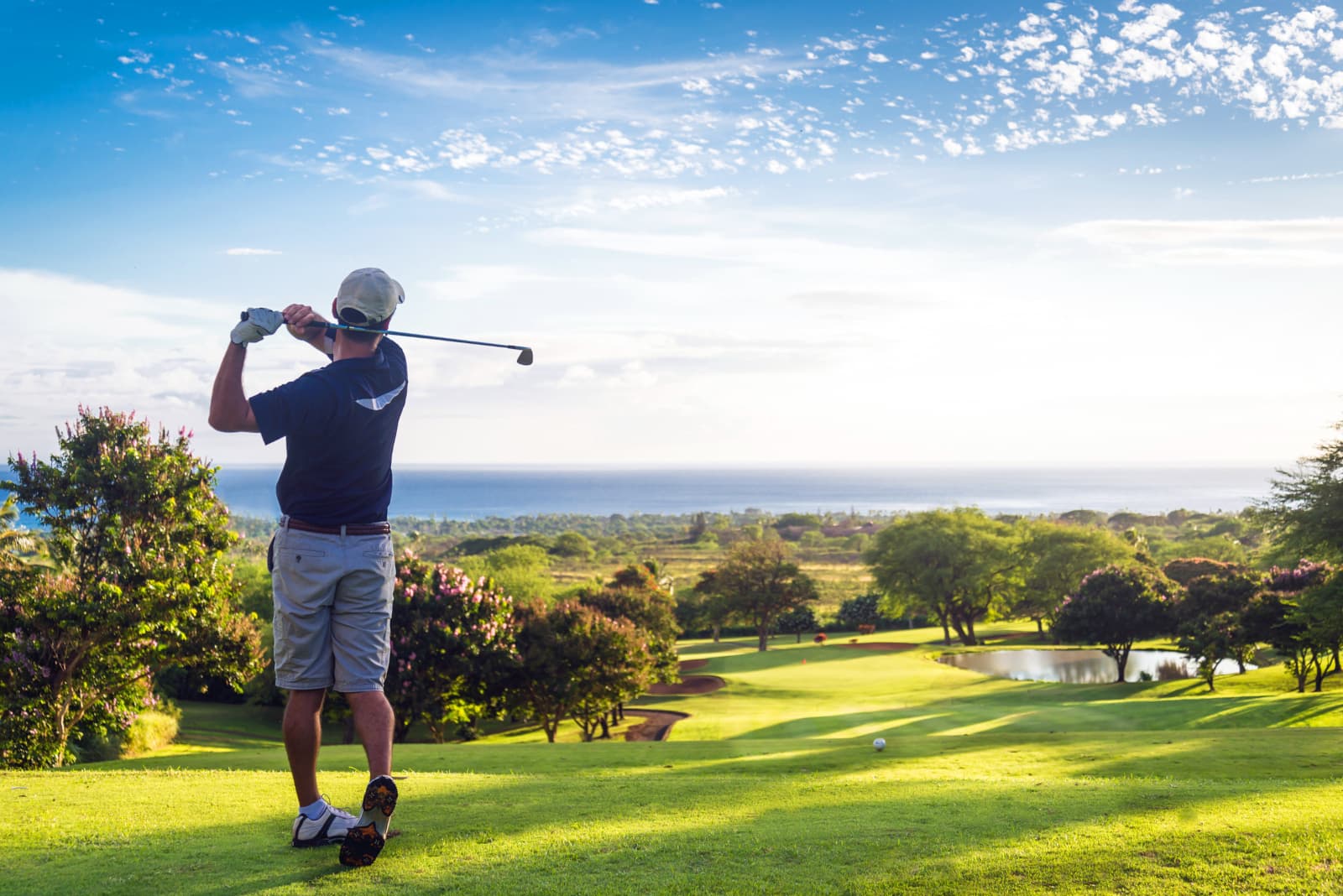 Green Golf Course With Open Blue Skies Above It
