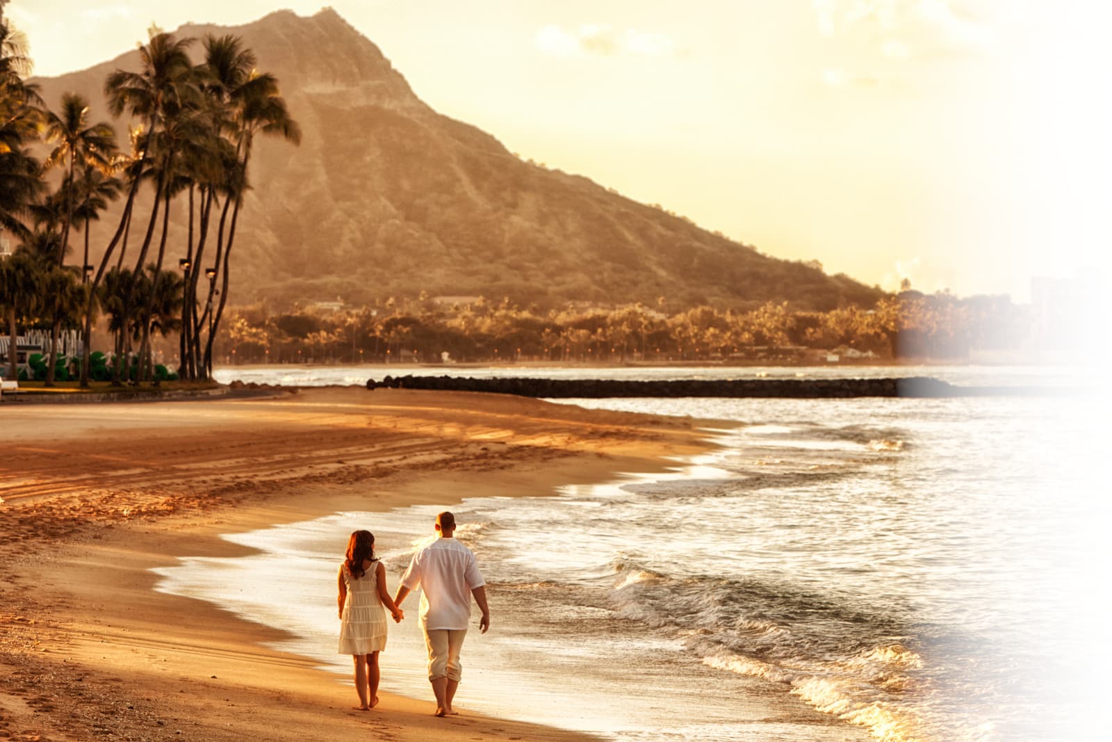 Family Walking On The Beach
