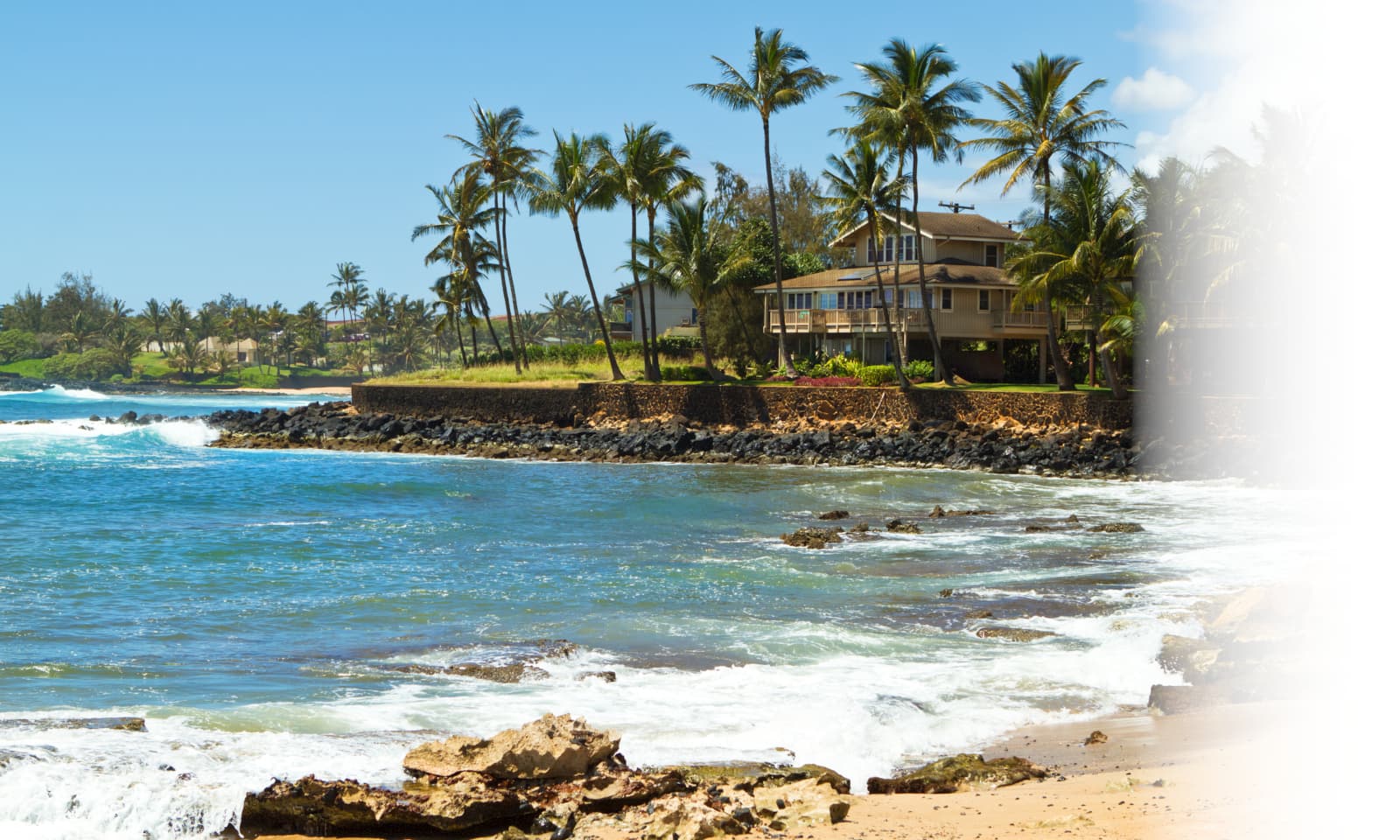 Home overlooking the ocean over a rocky beach