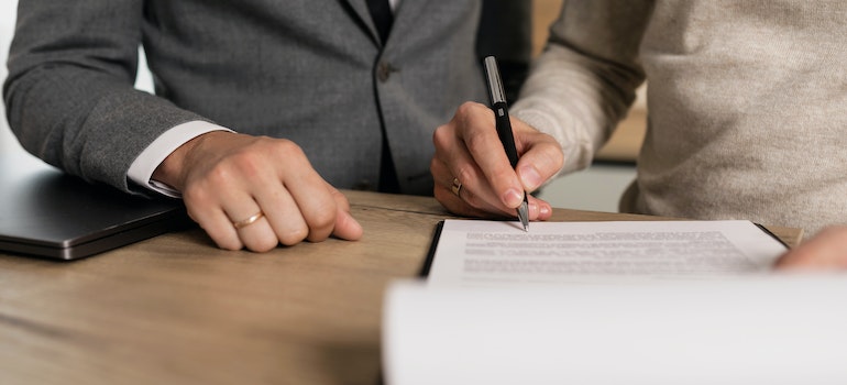 A first-time buyer signing a contract.
