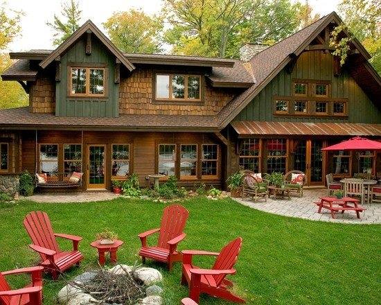 Green and brown mountain house in Highland Ranch, CO with red chairs