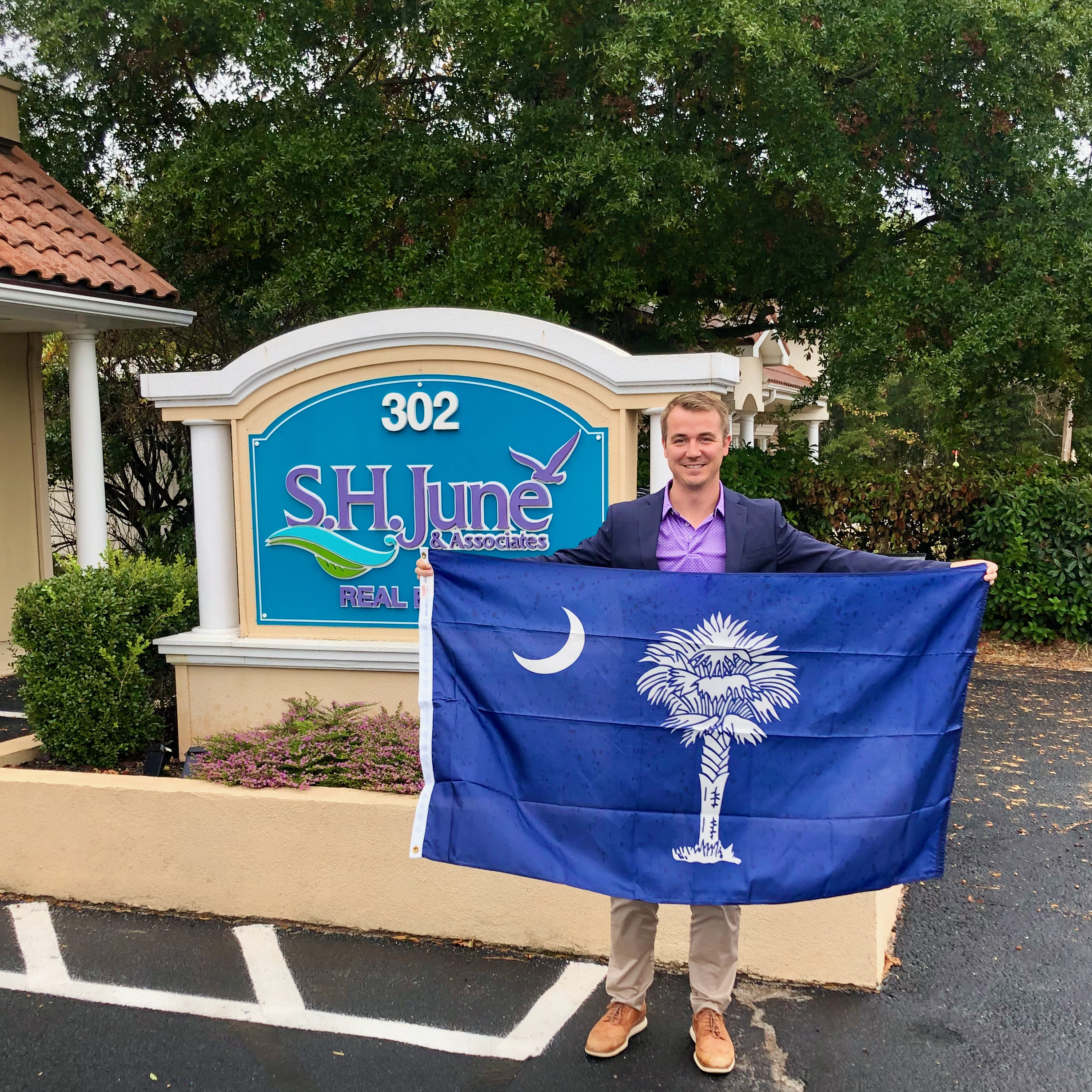This South Carolina State Flag flew at the state capital and was presented to Seth June (pictured holding the flag) for his continual contribution to the Realtor Party.