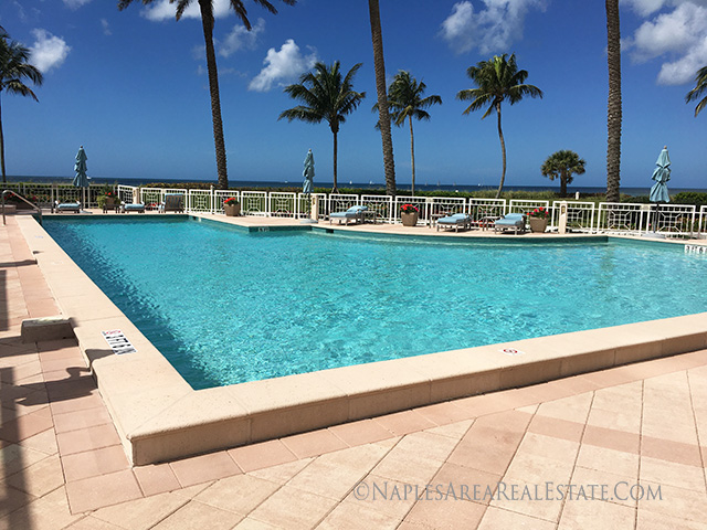 enclave condos naples swimming pool with beach view