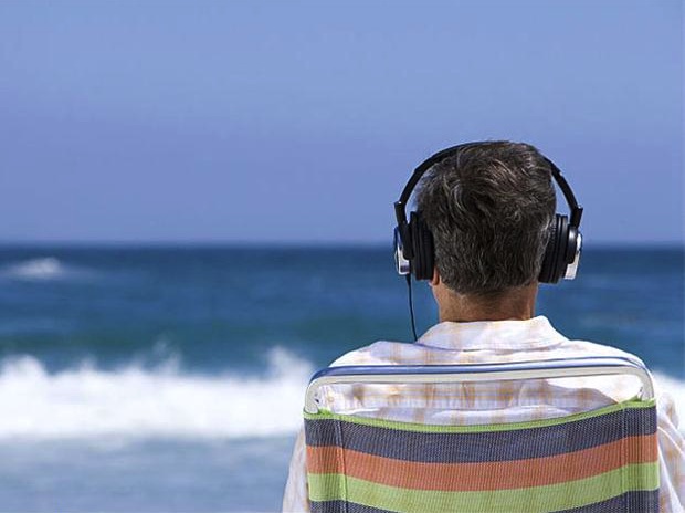 man_on_beach_wearing_headphones_620