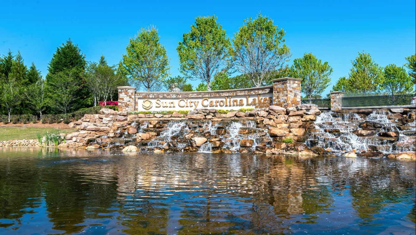 Sun City Carolina Lakes entrance monument with waterfall
