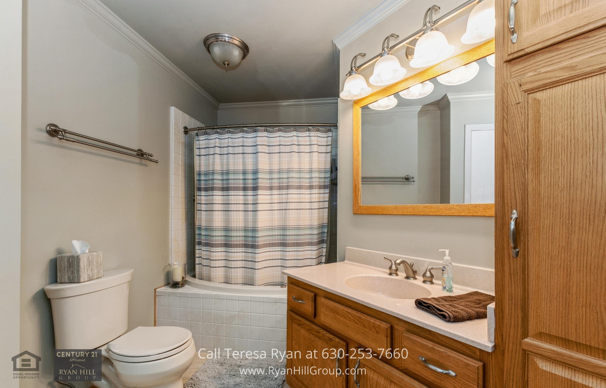 Soak away all your stress in a large oval jetted soaking tub in this Frankfort, IL home's master bathroom.