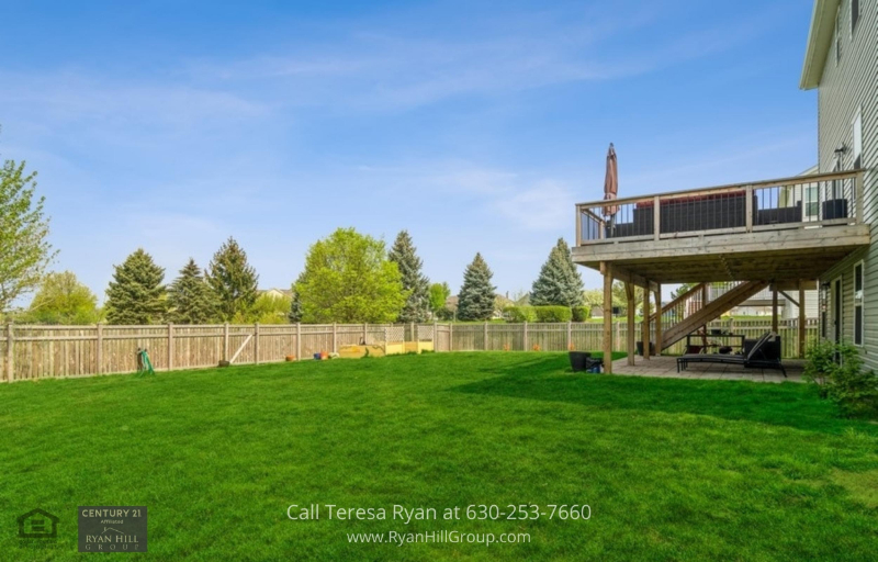 Yorkville, IL Home - The spacious fenced yard in this Yorkville, IL home is a perfect spot for outdoor activities.