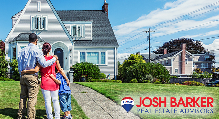 family in front of a home