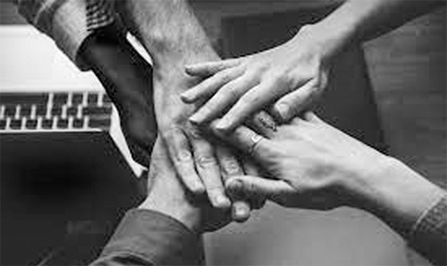 people putting their hands together