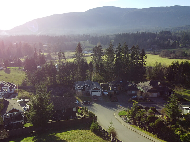 Aerial view of luxury homes on large acreages at the foot of Mount Benson