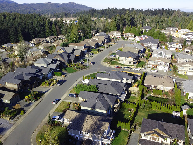 Aerial view of North Jingle Pot homes surrounded by green trees and parks