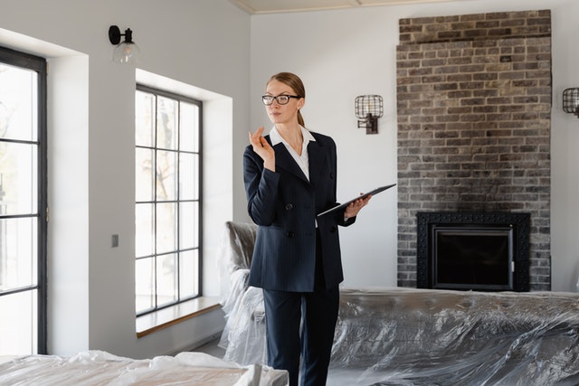 a woman checking a house interior