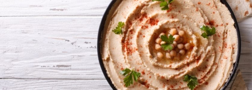 hummus plate on wood table