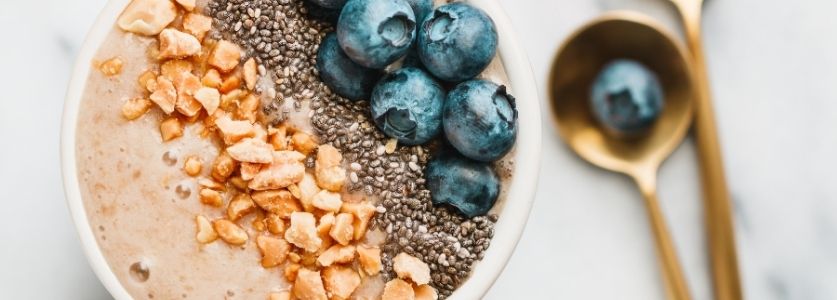acai bowl with granola and blueberry topping