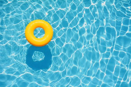 inner tube on water yellow inner tube floating on clear water