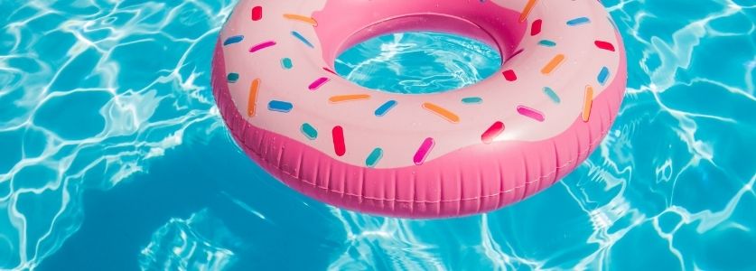 pink donut inner tube in swimming pool