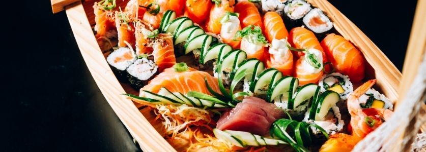 sushi boat on dark background