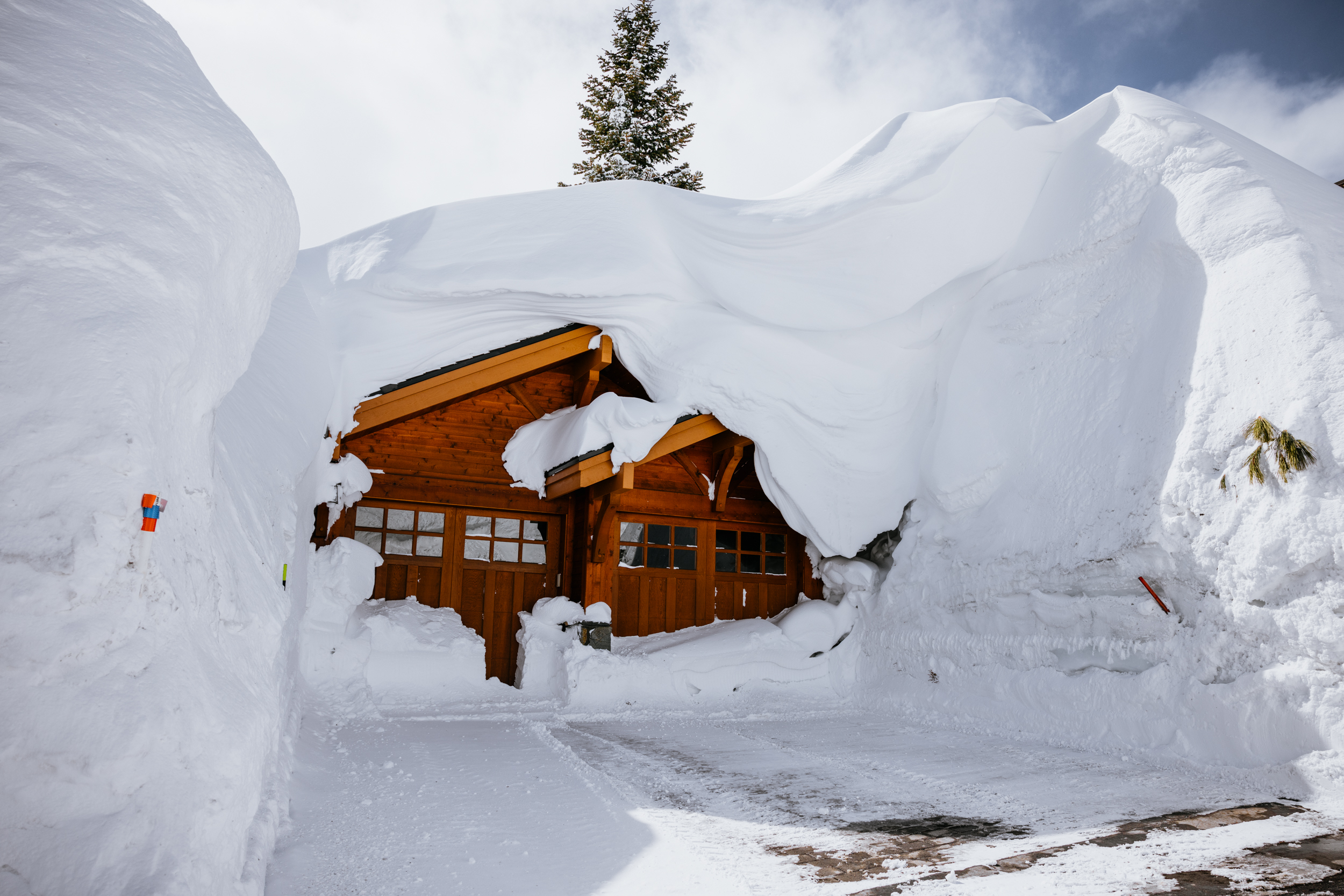 House Buried Under Deep Snow After Storm Series