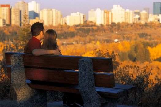 couple sitting and admiring the aerial view of edmonton
