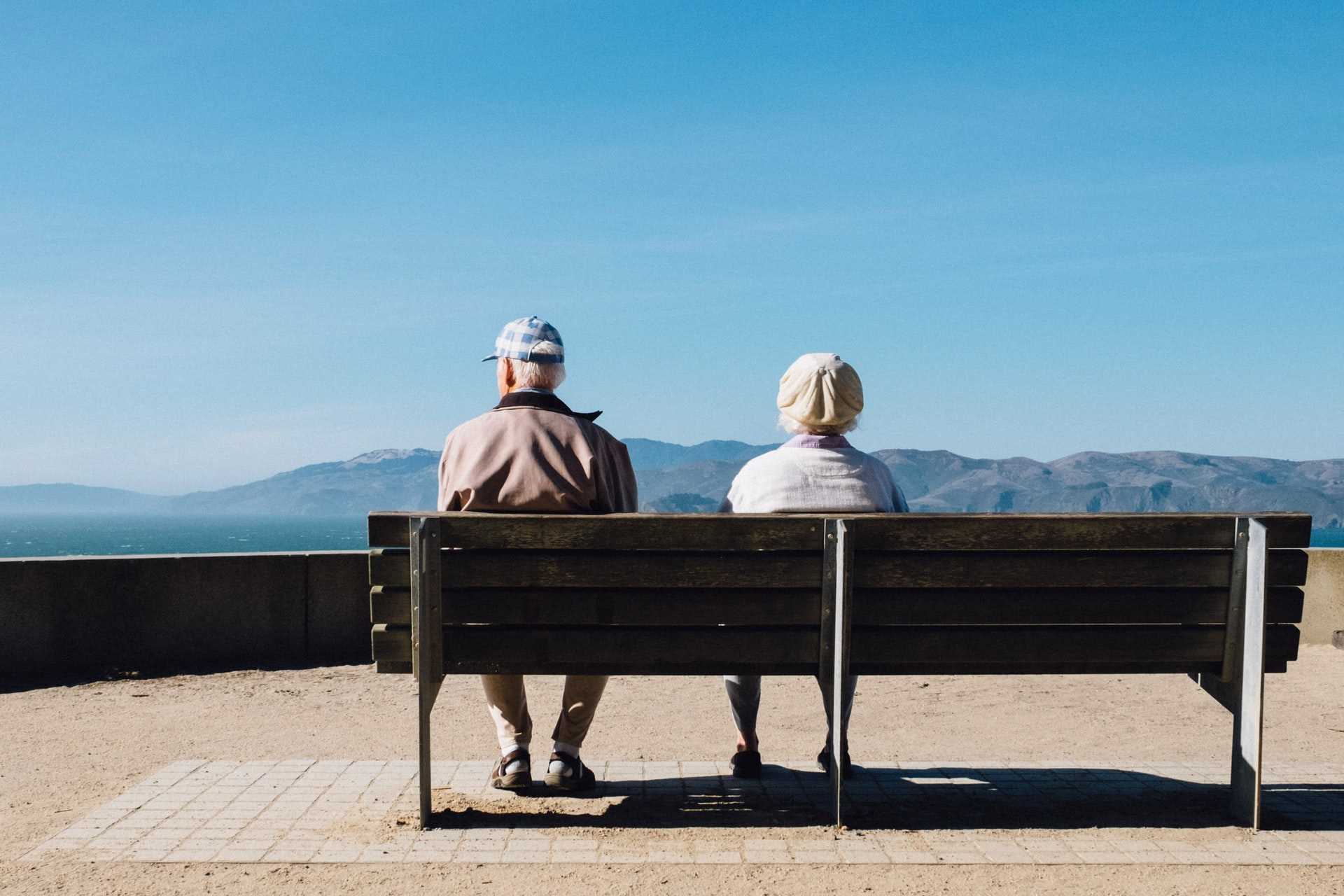 old couple sitting on a bench