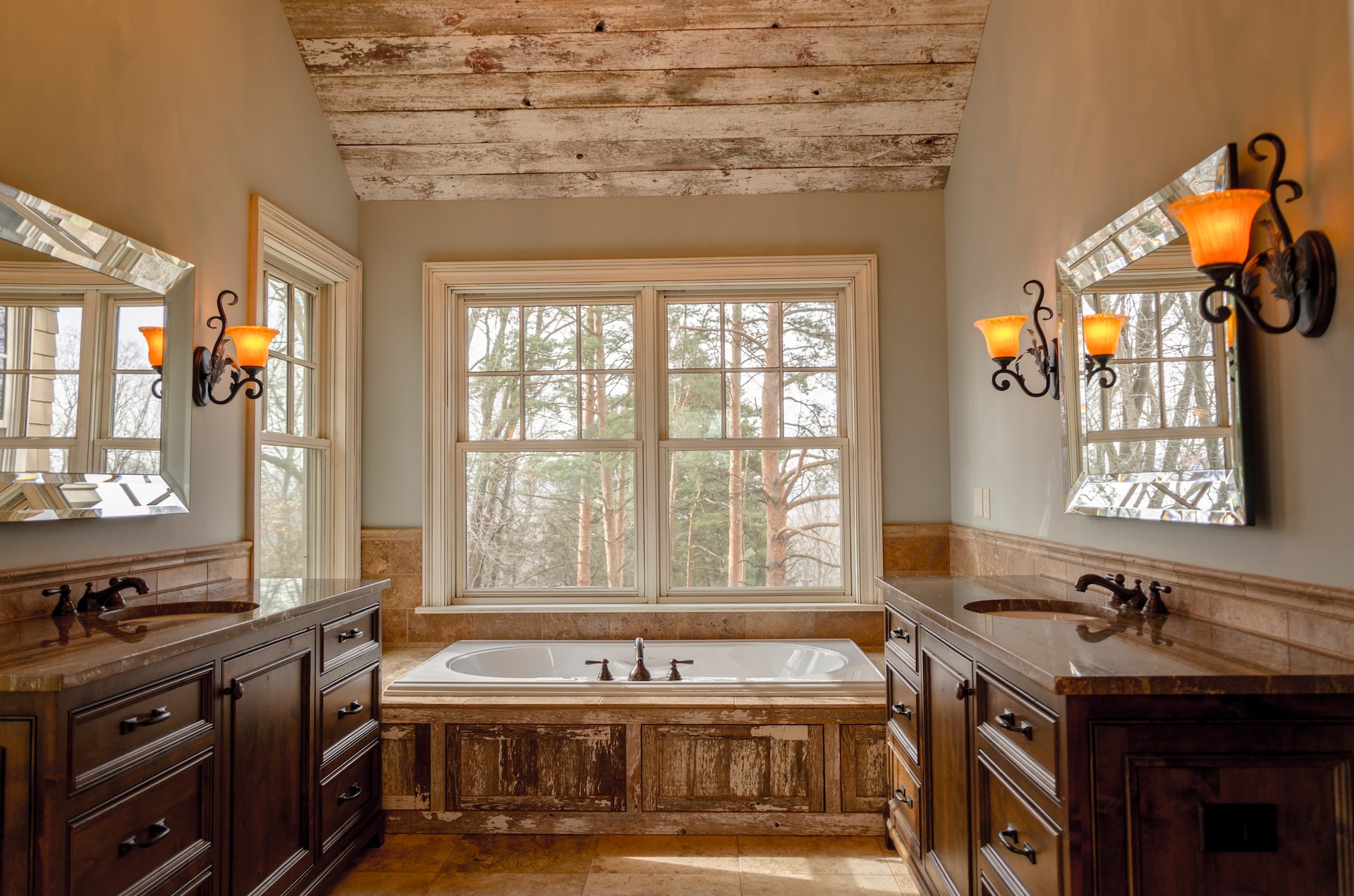A bathroom of a home in the woods.