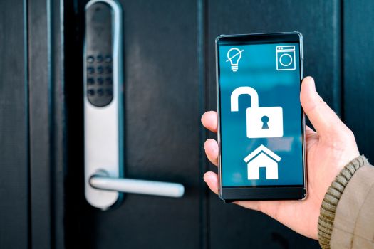 Smart phone unlocks front door to home.