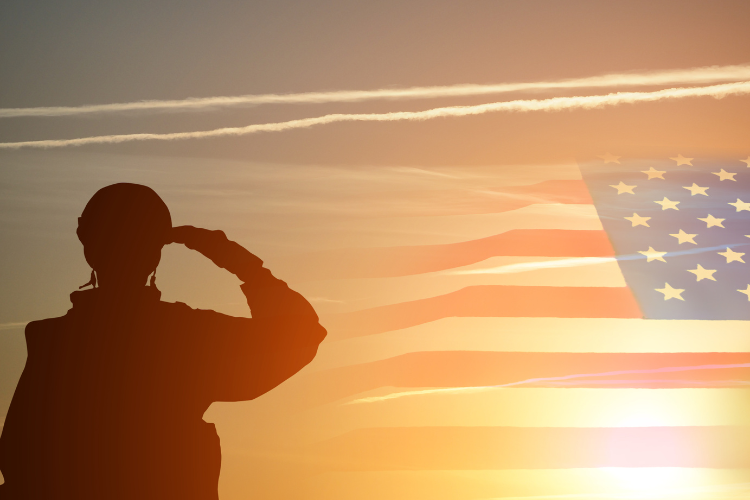 silhouette_of_soldier_saluting_american_flag_at_sunset