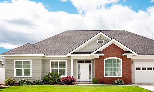 house with a green lawn