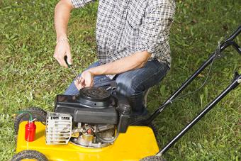 Man Fixing a Lawnmower