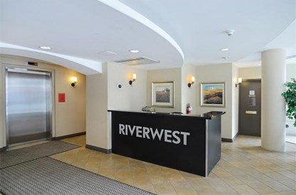 Lobby Desk & Elevator in the Riverwest Condos, Calgary, Alberta, Canada
