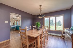 Quaint dining room on hardwood with excellent natural lighting throughout.