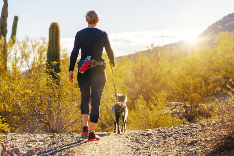 woman and her dog hiking in arizona