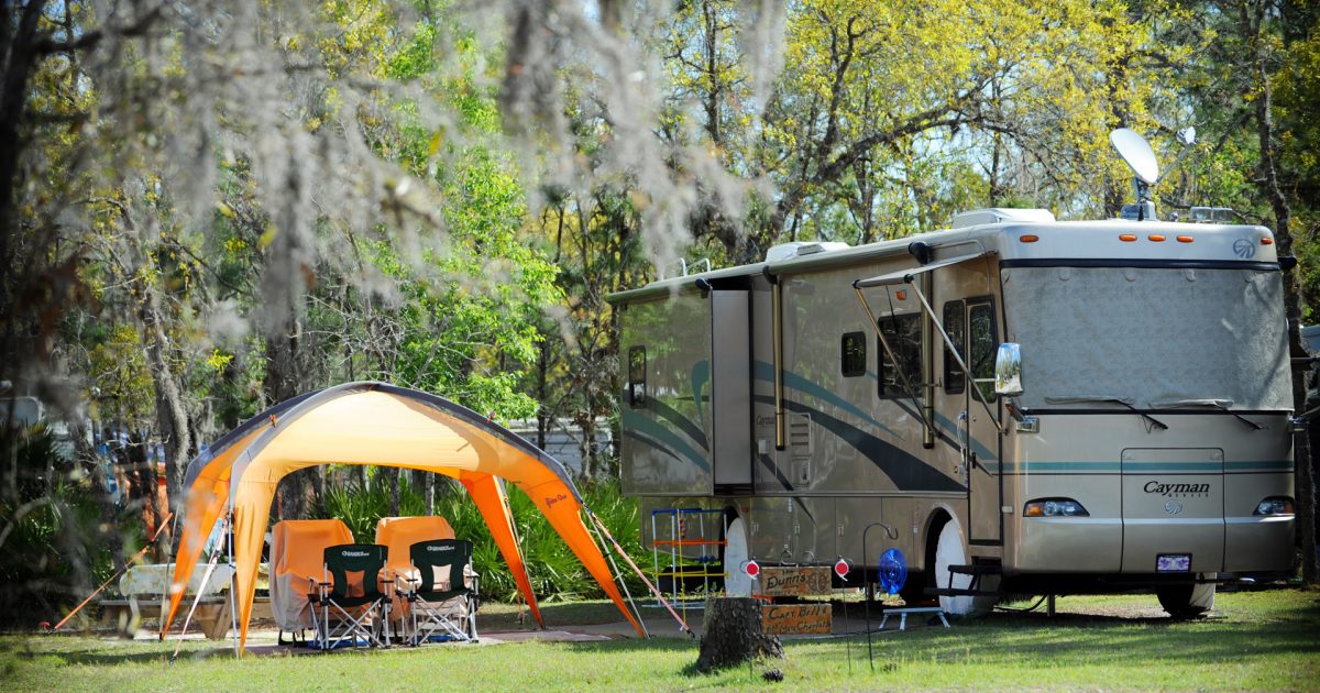 RV in campsite with tent