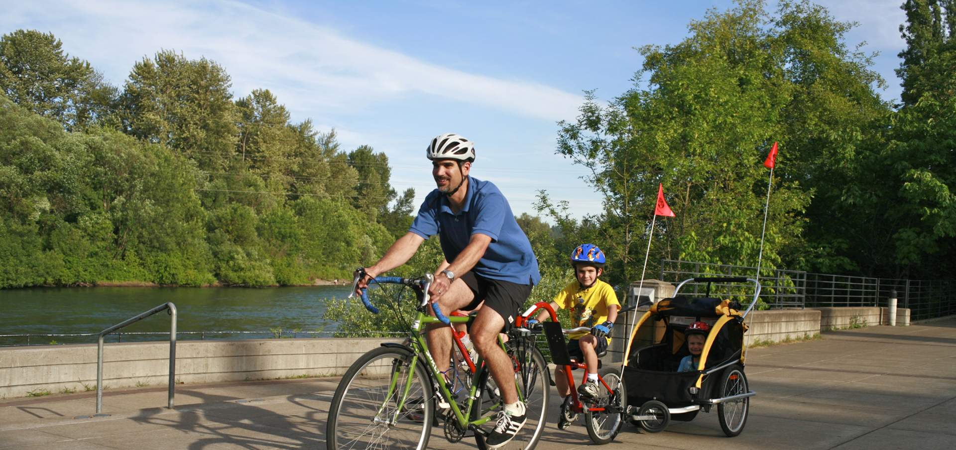 make biking with child on trail near river