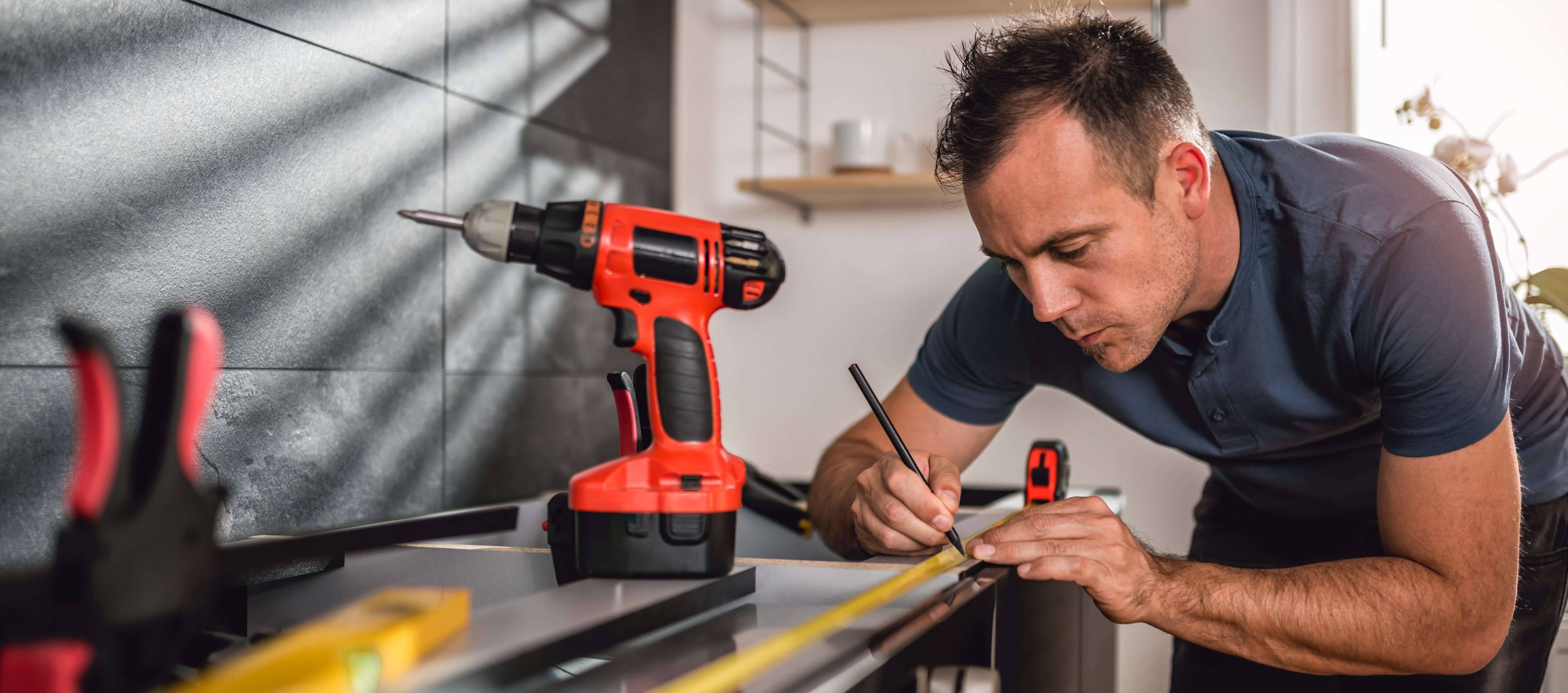 man working with tools on home improvements