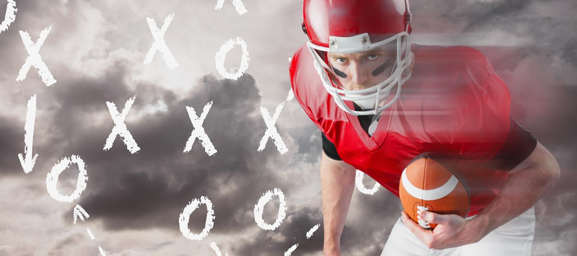 football player in front of chalkboard of X and Os