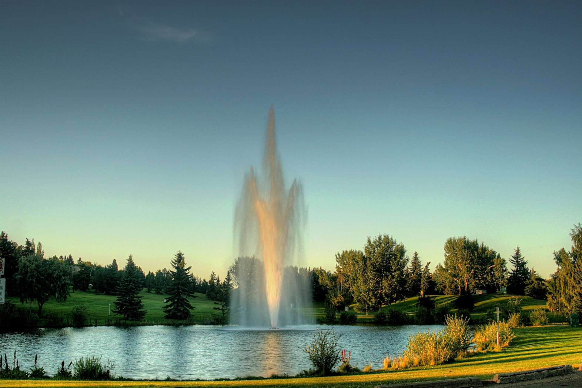 A fountain in a small pond at Rundle Park in Northeast Edmonton