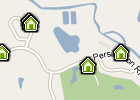 Close-up of a small map that has four house icons 