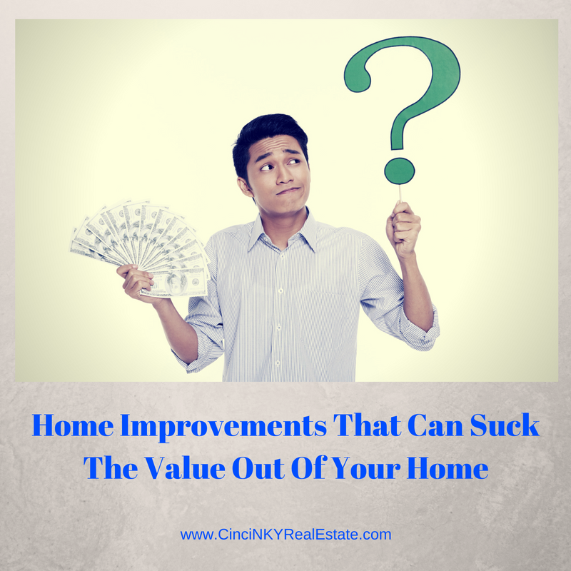 picture of man holding money and question mark with text home improvements that can suck the value out of your home