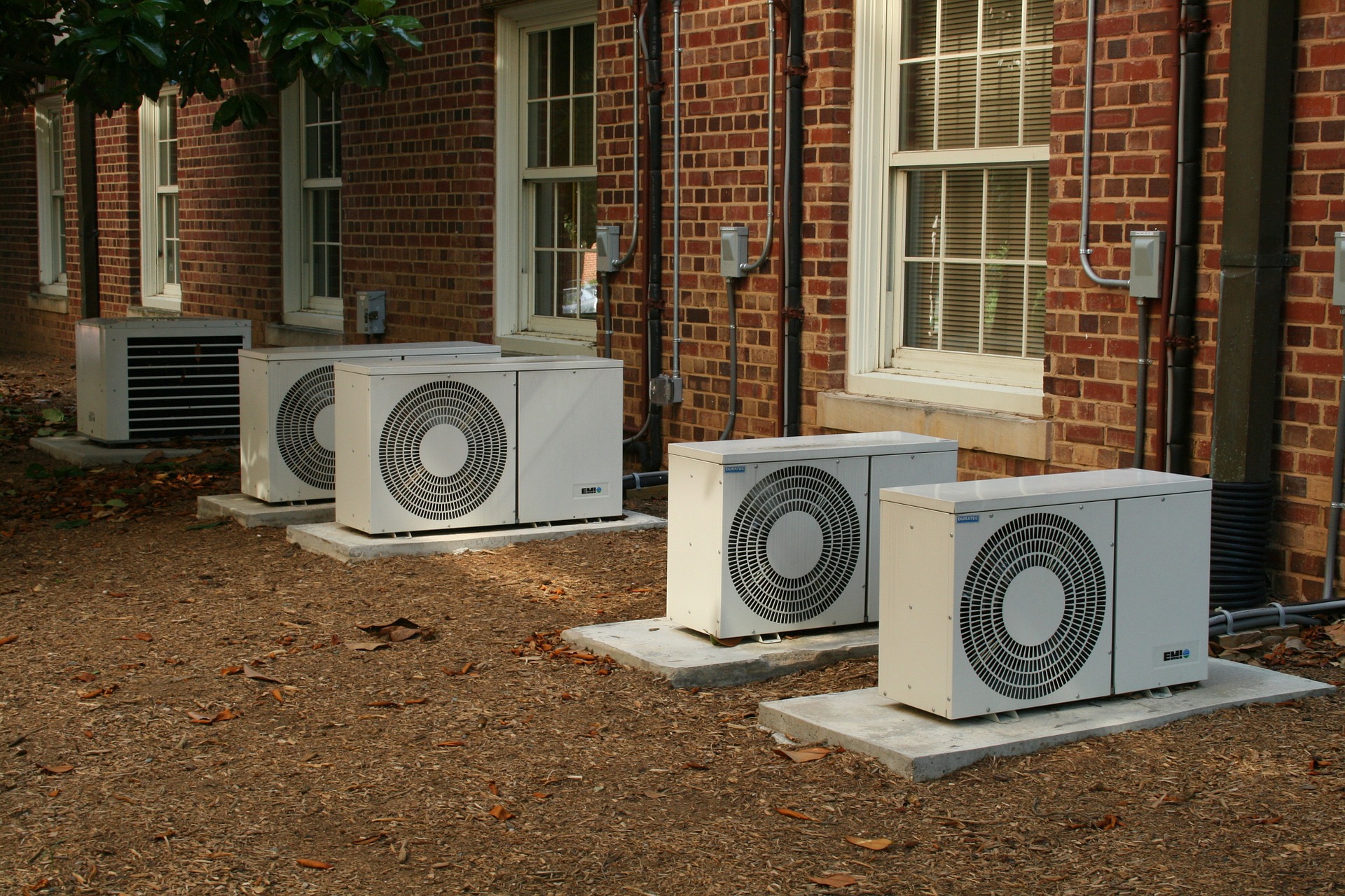 picture of compressors outside homes