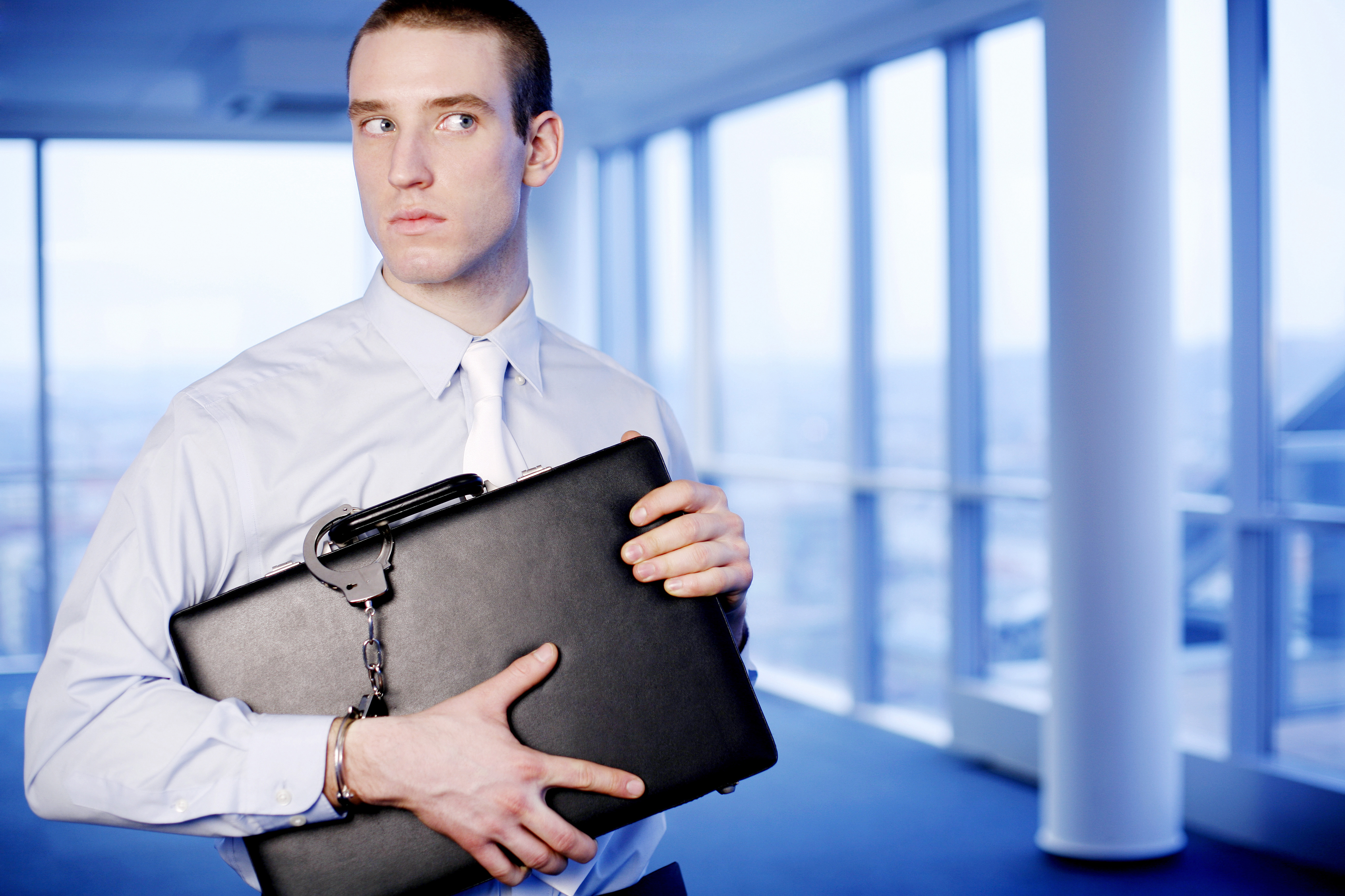man securing briefcase