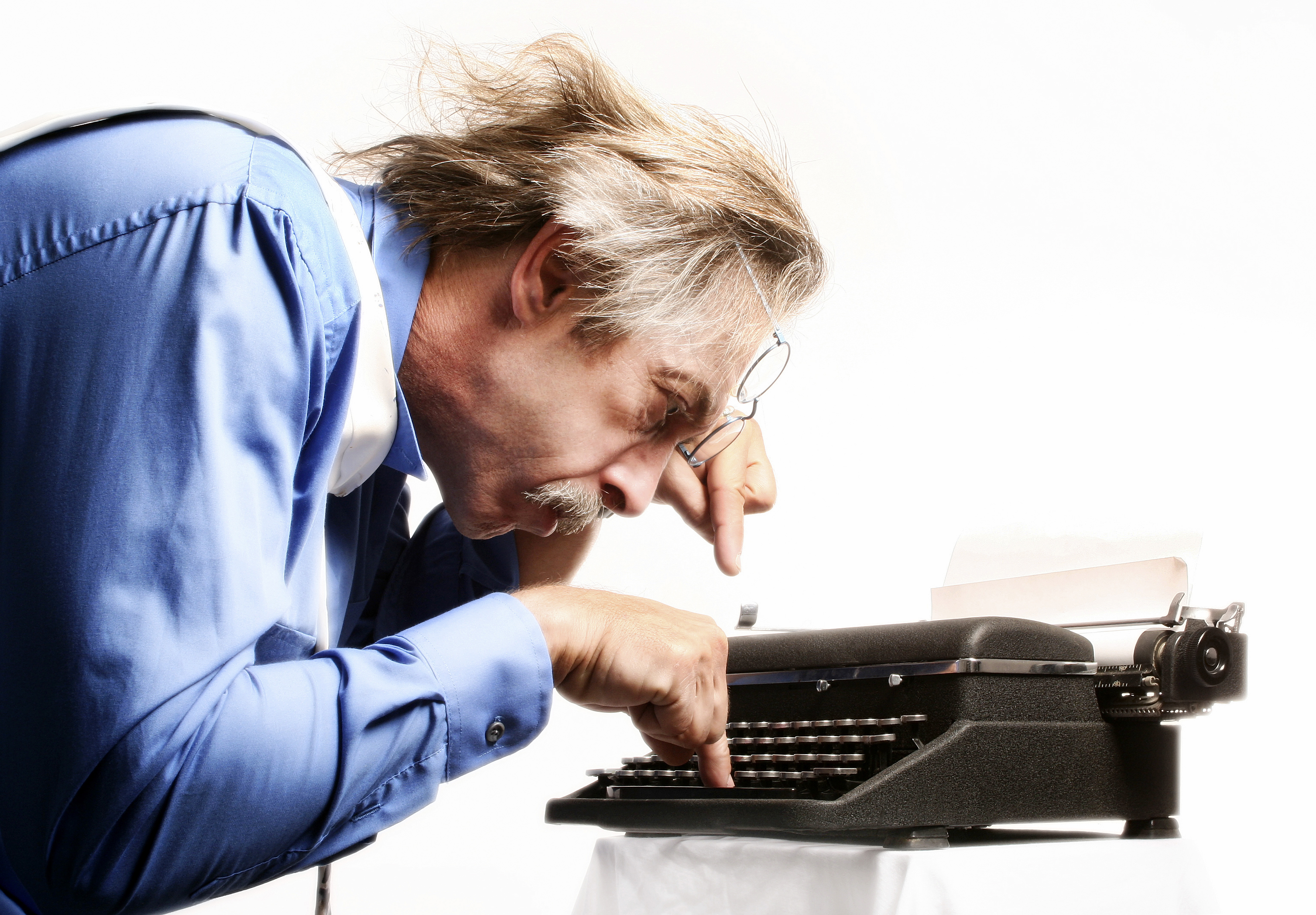 man using typewriter