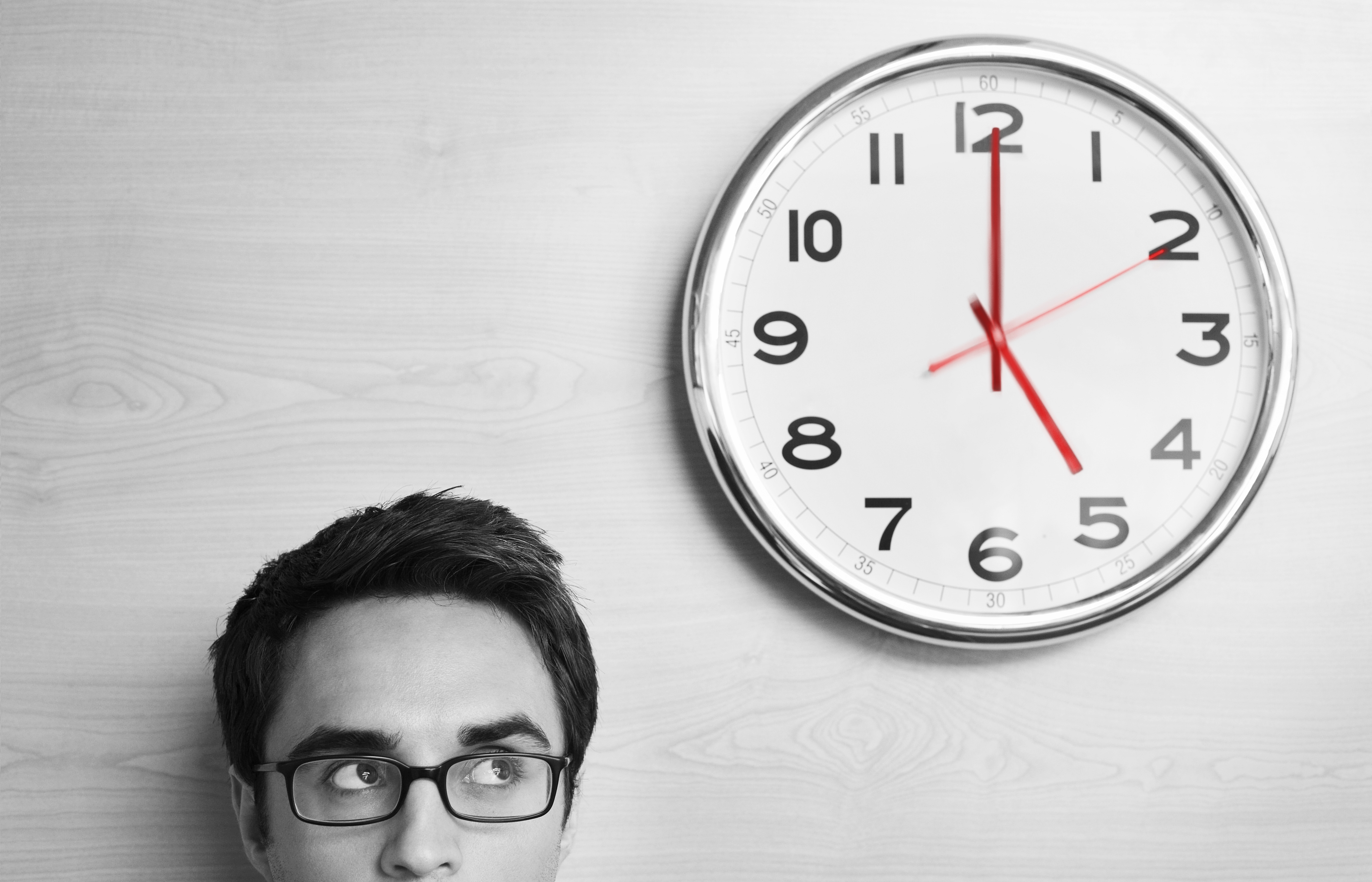 man watching the clock for a deadline