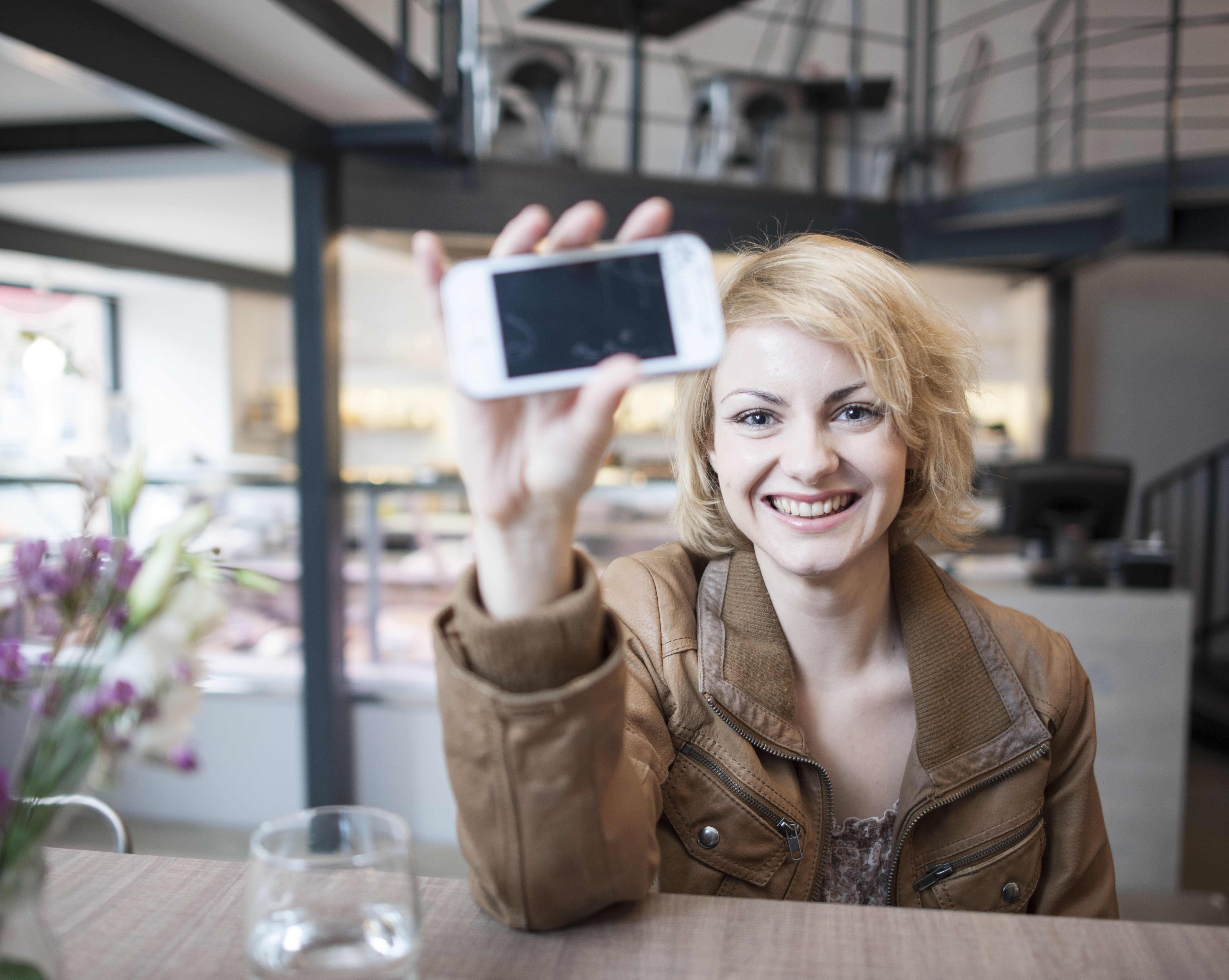 woman holding smart phone for smart home