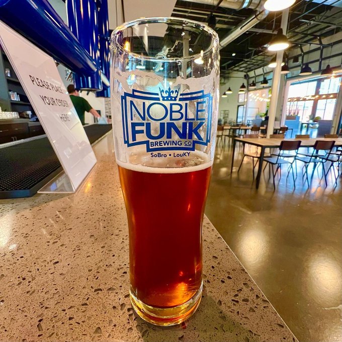 photo of a glass with craft beer from Noble Funk Brewing in Louisville