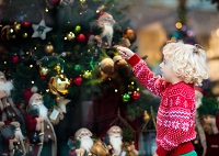 child with Christmas tree