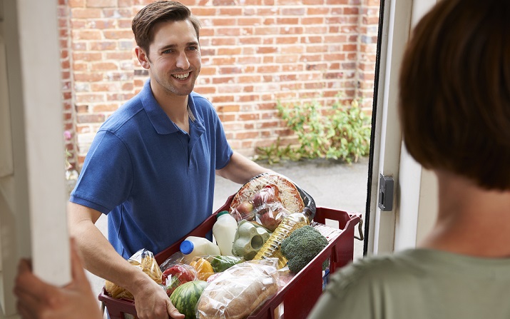 Young man delivering groceries